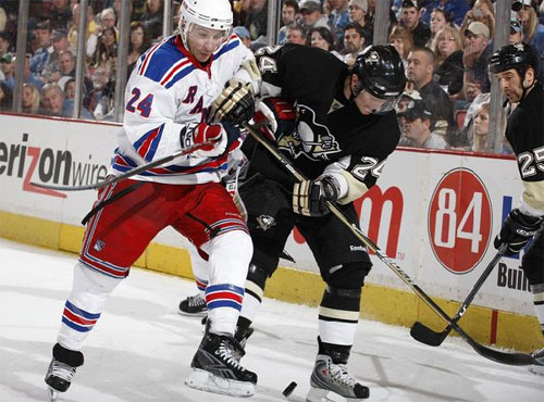 Matt Cooke plays the puck against the Rangers on 3/28/09