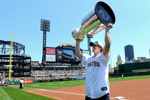 Sidney Crosby raises the cup in front of a sold out crowd at PNC Park
