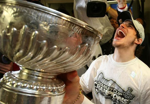 Sidney Crosby takes celebratory drink from the Stanley Cup