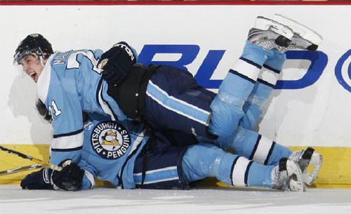 Evgeni Malkin congratulates teammate Petr Sykora , who scored with 2:28 remaining in the third period to beat the Islanders 1-0 on March 25, 2009.