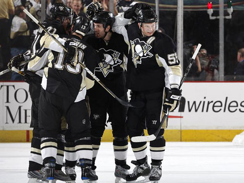 The Penguins mob teammate Bill Guerin Friday after the veteran tallied the game-winning goal in OT, giving Pittsburgh a 2-0 series lead over the Flyers heading into Philadelphia. 