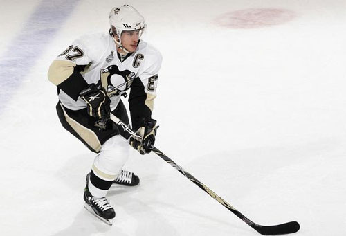 Sidney Crosby lugs the puck up ice against the Red Wings in Game 1 of the Stanley Cup Finals