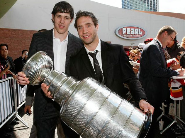 Max Talbot and Evgeni Malkin take time to pose with the Stanley Cup at the NHL Awards