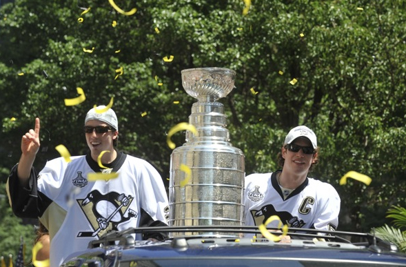 Marc-Andre Fleury and Sidney Crosby ride along in the Champions Parade on 6/15/09